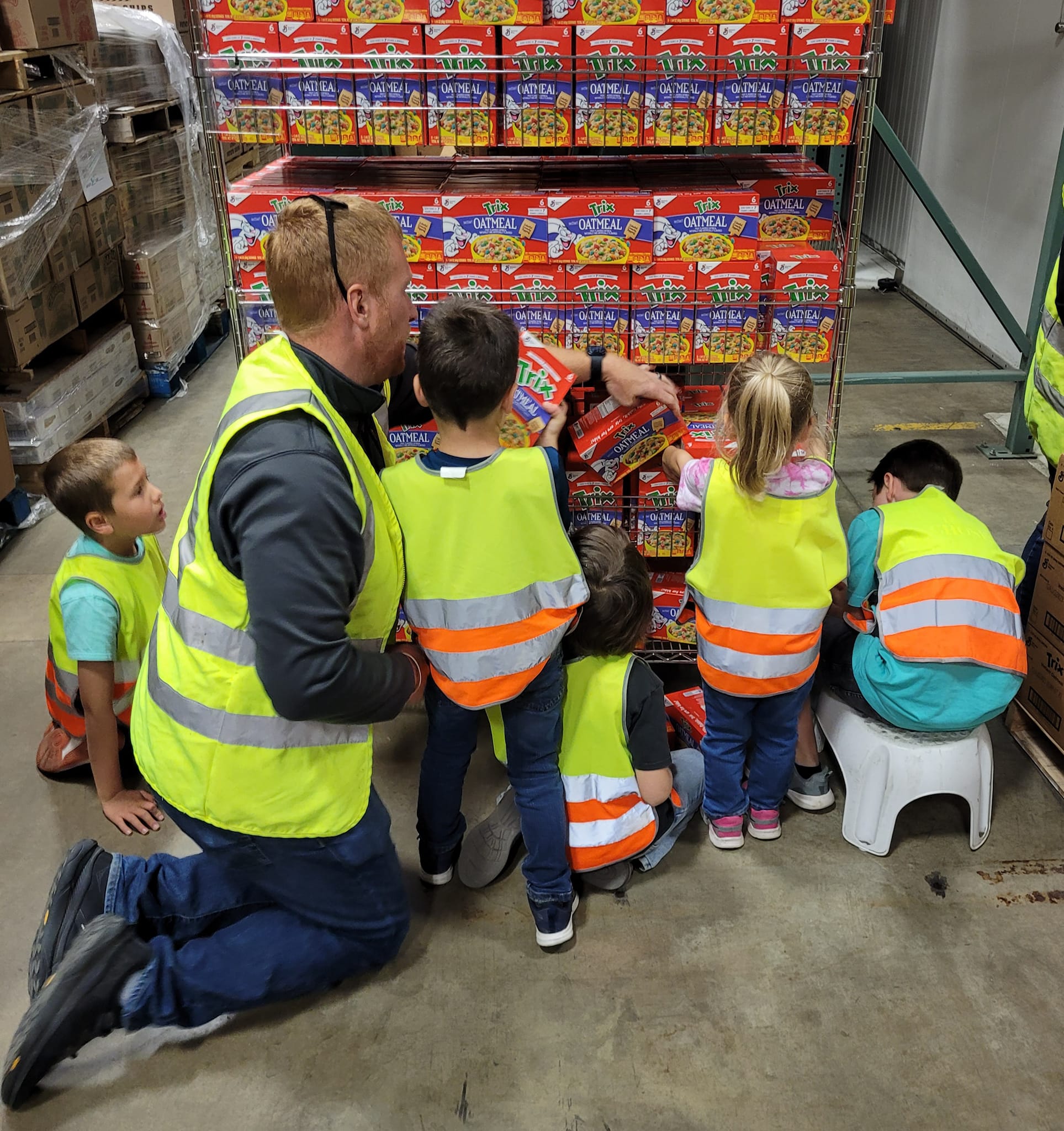 Children volunteering at Community Harvest Food Bank