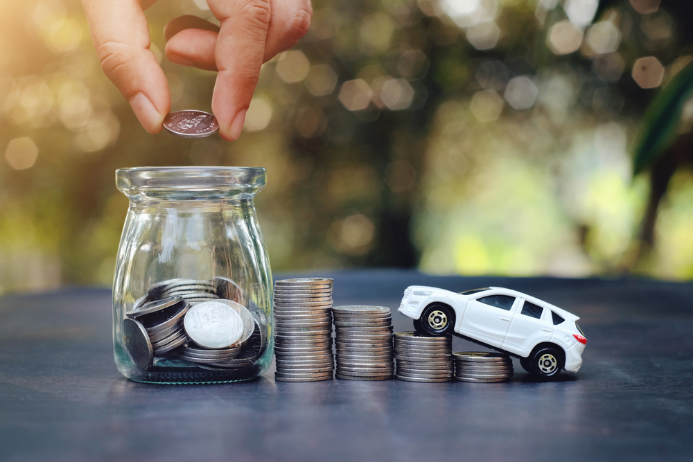 A change jar and miniature car.