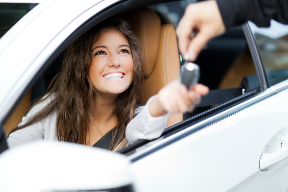 Woman buying new car.