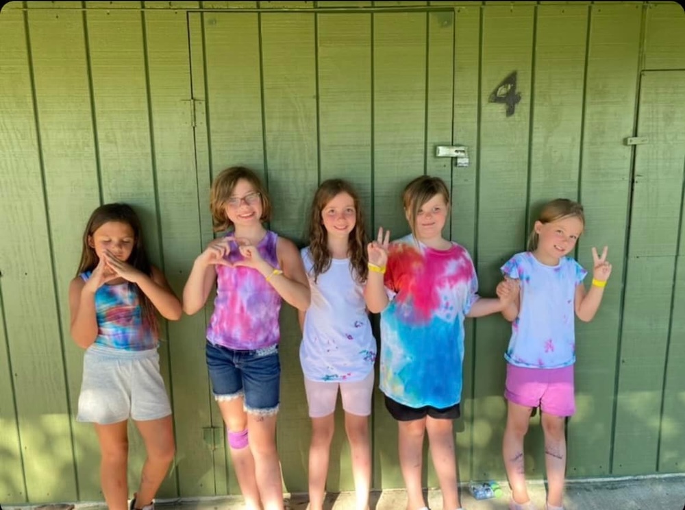 Kids posing for a photo at Camp Whitley