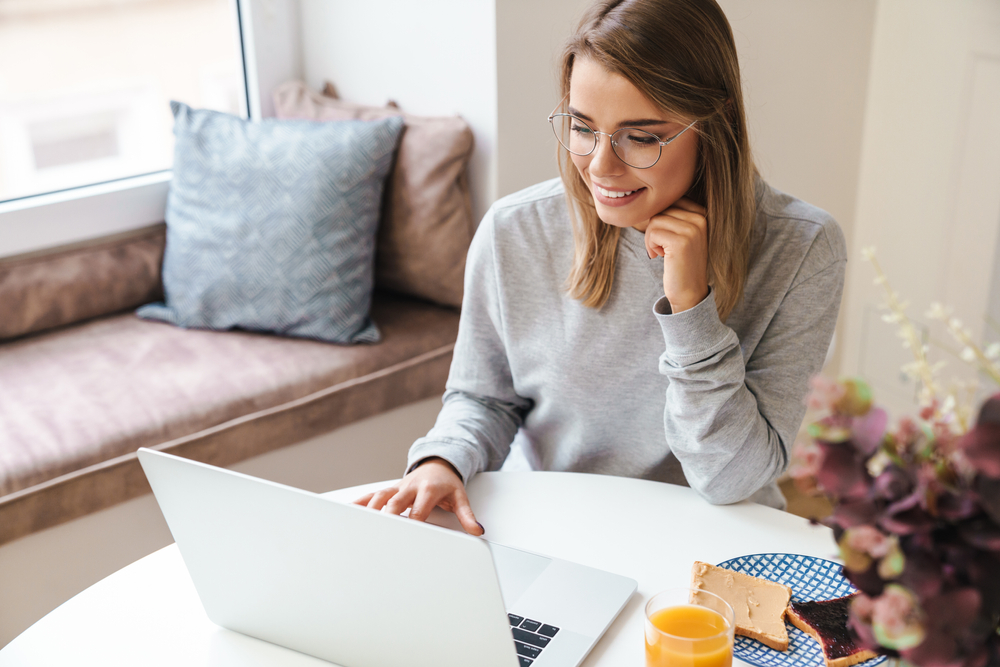 Young woman on laptop at home.