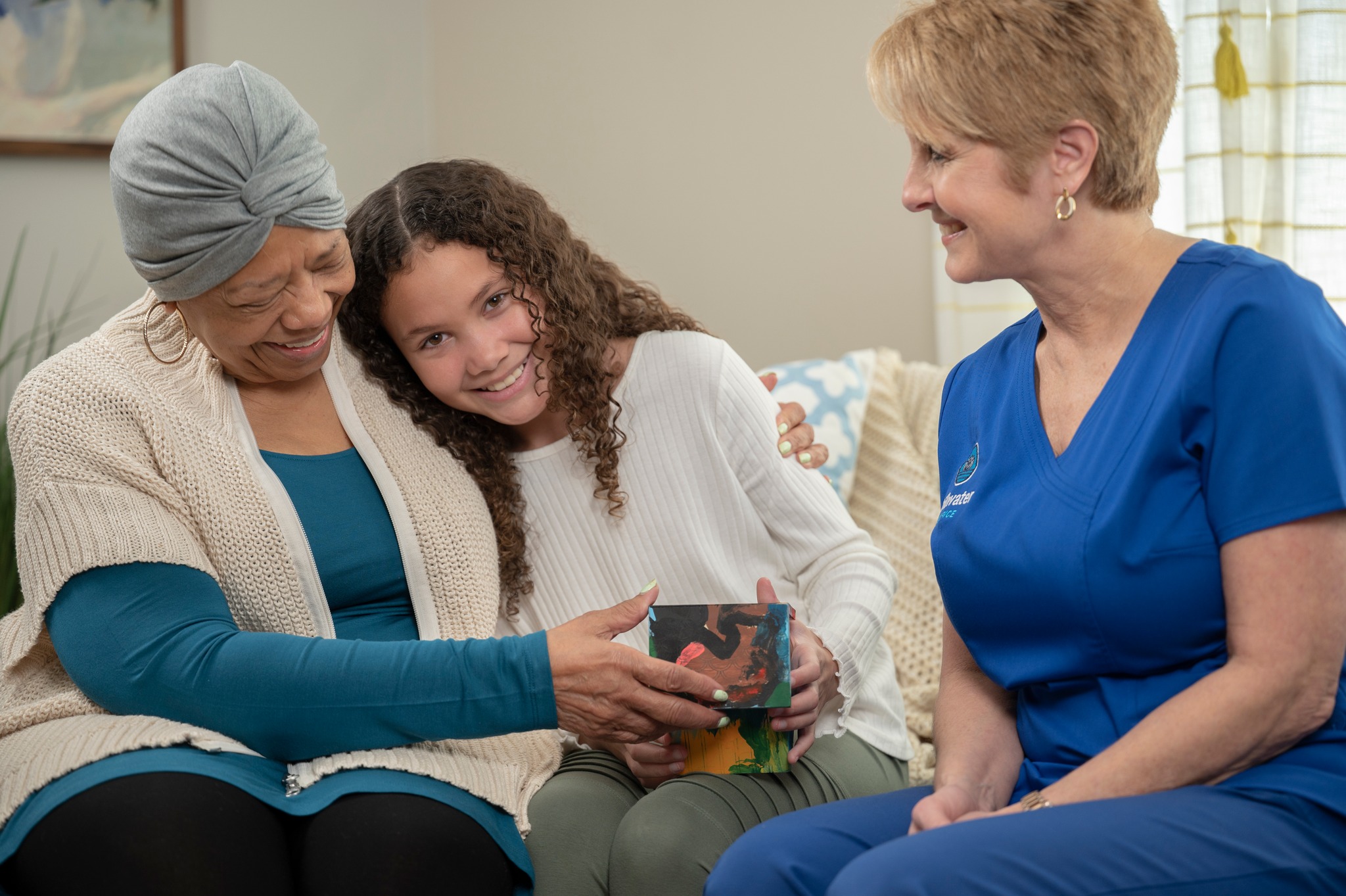 A Stillwater Hospice caregiver, patient, and family member.