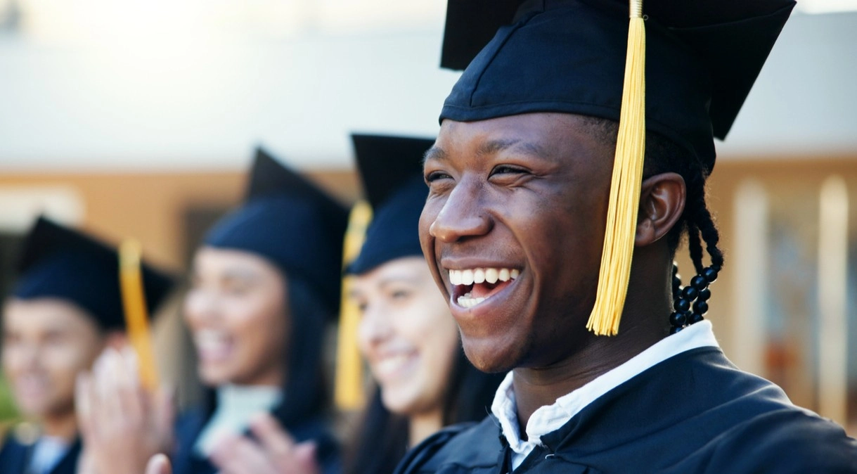 A graduate in his cap and gown